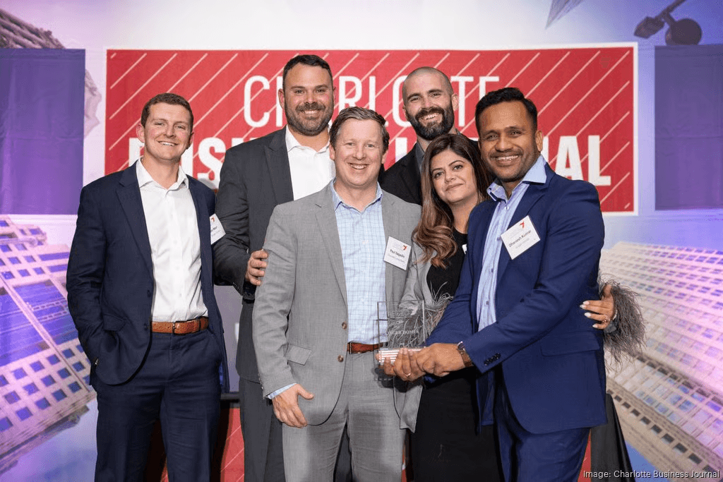 KDG team receiving a Charlotte Business Journal award
